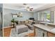 Cozy living room with a comfortable sectional sofa, stylish decor, and wood-look flooring at 542 Black Lion Ne Dr, St Petersburg, FL 33716