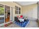 Inviting screened patio with comfortable seating, stylish blue rug, and a view of the bright living area at 542 Black Lion Ne Dr, St Petersburg, FL 33716