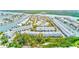 Aerial view of a coastal community with waterfront homes, docks, and lush greenery at 615 Garland Cir, Indian Rocks Beach, FL 33785
