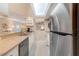 Bright kitchen featuring stainless steel appliances, tile flooring, and an open design at 615 Garland Cir, Indian Rocks Beach, FL 33785