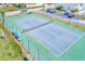 Enjoy a private fenced tennis court in this residential neighborhood at 615 Garland Cir, Indian Rocks Beach, FL 33785