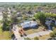 An aerial shot of a lovely home with a large backyard, pool, and beautiful landscaping at 6235 Viola Ln, New Port Richey, FL 34653