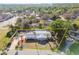 Aerial view of the single-story home with well-maintained landscaping and outlining property line at 6235 Viola Ln, New Port Richey, FL 34653