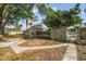Spacious backyard with potential for landscaping or outdoor activities, shaded by mature trees at 6235 Viola Ln, New Port Richey, FL 34653