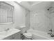 Bathroom with shower and bath featuring marble accents at 6235 Viola Ln, New Port Richey, FL 34653