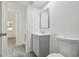 Bathroom featuring updated vanity and toilet with modern fixtures at 6235 Viola Ln, New Port Richey, FL 34653