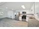 Updated kitchen has stainless appliances, stone countertops and white subway tile backsplash at 6235 Viola Ln, New Port Richey, FL 34653