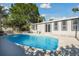 Refreshing pool with a patio, perfect for relaxation and outdoor enjoyment at 6235 Viola Ln, New Port Richey, FL 34653