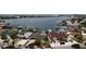 Aerial view of waterfront homes showcasing the coastal lifestyle, including docks, boats, and stunning bay views at 6319 Cocoa Ln, Apollo Beach, FL 33572