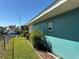 Picturesque backyard featuring a lush lawn, privacy fence, and waterfront access, perfect for outdoor activities at 6319 Cocoa Ln, Apollo Beach, FL 33572
