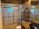 Bathroom featuring tiled walls, shower-tub combo, and vanity with granite countertop at 6319 Cocoa Ln, Apollo Beach, FL 33572