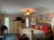 Spacious bedroom with a comfortable king-sized bed, complemented by warm lighting and classic decor elements at 6319 Cocoa Ln, Apollo Beach, FL 33572