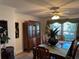 Traditional dining room featuring wooden furniture, window views, and elegant decor, offering an inviting space for meals at 6319 Cocoa Ln, Apollo Beach, FL 33572