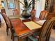 Inviting dining room with a hardwood table set for six, offering an elegant space for gatherings and meals at 6319 Cocoa Ln, Apollo Beach, FL 33572