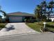 Charming home with a paver driveway, lush landscaping, and a two-car garage offering curb appeal and convenience at 6319 Cocoa Ln, Apollo Beach, FL 33572