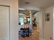 Stylish hallway showcases a decorative dolphin and a glimpse of the kitchen at 6319 Cocoa Ln, Apollo Beach, FL 33572