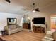 Cozy living room featuring a wet bar, comfortable seating, and natural light at 6319 Cocoa Ln, Apollo Beach, FL 33572