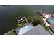 Stunning aerial view of the canal front, screened-in pool, and boat lifts providing a luxury waterfront lifestyle at 6319 Cocoa Ln, Apollo Beach, FL 33572