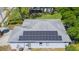 Aerial view of a home with solar panels on the roof at 6426 31St S St, St Petersburg, FL 33712