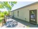 Home's backyard featuring a wooden deck, greenery, and patio area at 6426 31St S St, St Petersburg, FL 33712