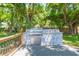 Outdoor kitchen area featuring stainless steel appliances, stone backsplash, and a granite countertop at 6426 31St S St, St Petersburg, FL 33712