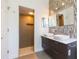 Modern bathroom featuring dual vessel sinks, marble counters, and tiled shower at 6426 31St S St, St Petersburg, FL 33712