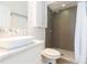 This bathroom features white vanity with double sinks, mosaic tile, and a walk-in shower at 6426 31St S St, St Petersburg, FL 33712