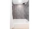 Modern bathroom featuring tiled shower with rainfall shower head over the tub at 6426 31St S St, St Petersburg, FL 33712