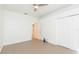 Neutral bedroom with tiled flooring, closet, and ceiling fan for comfort at 6426 31St S St, St Petersburg, FL 33712