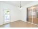 Dining room with tiled floors, glass doors to the exterior, and modern lighting at 6426 31St S St, St Petersburg, FL 33712