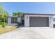 Well-kept single-story house with a two-car garage, manicured lawn, and tidy landscaping at 6426 31St S St, St Petersburg, FL 33712