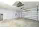 Spacious two car garage featuring a white door and grey paint at 6426 31St S St, St Petersburg, FL 33712