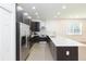 Modern kitchen with stainless steel appliances, stylish backsplash, and sleek cabinetry at 6426 31St S St, St Petersburg, FL 33712