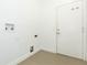 Functional laundry room with a door to the exterior, tiled floors and water hookups at 6426 31St S St, St Petersburg, FL 33712