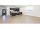 Open floor plan with tile flooring adjoining the kitchen and entryway at 6426 31St S St, St Petersburg, FL 33712