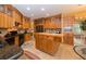 Spacious kitchen boasts custom cabinetry, granite countertops, and a functional center island at 6448 Country Club Rd, Wesley Chapel, FL 33544