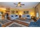Comfortable living room with couches, hardwood floors, and elegant decor at 6448 Country Club Rd, Wesley Chapel, FL 33544