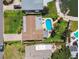 Aerial view of home showcasing a private pool, lush landscaping, and proximity to the waterfront at 6667 28Th S St, St Petersburg, FL 33712