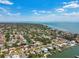 Drone shot shows coastal community, homes, docks, and waterways at 6667 28Th S St, St Petersburg, FL 33712