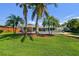 Large, lush backyard with mature landscaping, pool, and covered patio at 6667 28Th S St, St Petersburg, FL 33712