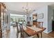 Dining room with natural light and pool views, connecting to the kitchen, creating an inviting entertaining space at 6667 28Th S St, St Petersburg, FL 33712