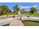 Private dock with boat lift, stairs to lawn, and house in the background at 6667 28Th S St, St Petersburg, FL 33712