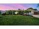 Charming single-story home with well-maintained landscaping, columns, and lush lawn at 6667 28Th S St, St Petersburg, FL 33712