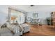 Bright living room with hardwood floors, large windows, comfortable seating, and stylish decor create a welcoming space at 6667 28Th S St, St Petersburg, FL 33712