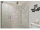 A bright shower with a modern tiled shower with frameless glass doors at 6667 28Th S St, St Petersburg, FL 33712