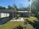 Charming single-story home featuring a carport, walkway lights, and a well-maintained front lawn at 7106 S Sparkman St, Tampa, FL 33616