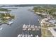 Aerial view showcasing waterfront homes, a marina filled with boats, and scenic views, perfect for boaters at 7819 Chasco St, Port Richey, FL 34668