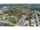Aerial view of a property and its surroundings, showcasing its location with nearby roads and greenery at 7819 Chasco St, Port Richey, FL 34668