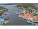 Aerial view capturing waterfront restaurants, a marina, and scenic waterfront views, perfect for boaters at 7819 Chasco St, Port Richey, FL 34668