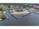 Aerial view of a waterfront restaurant with outdoor seating and a dock for boats, ideal for dining at 7819 Chasco St, Port Richey, FL 34668